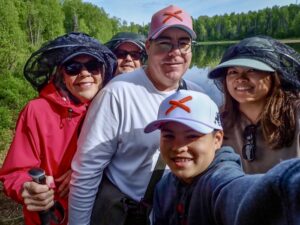 David and Carol Porter with family during a Tauck Bridges Alaska adventure, illustrating how meaningful travel experiences create lasting memories.