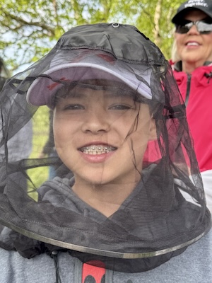 Ryan wearing a mosquito head net during a family hike on our Tauck Bridges Call of the Wild adventure in Alaska.