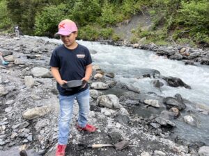 Ryan panning for gold in an Alaskan stream during the Tauck Bridges Call of the Wild family adventure.