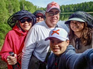 Three generations of our family taking a selfie during a Tauck Bridges scavenger hunt hike near Talkeetna, Alaska.