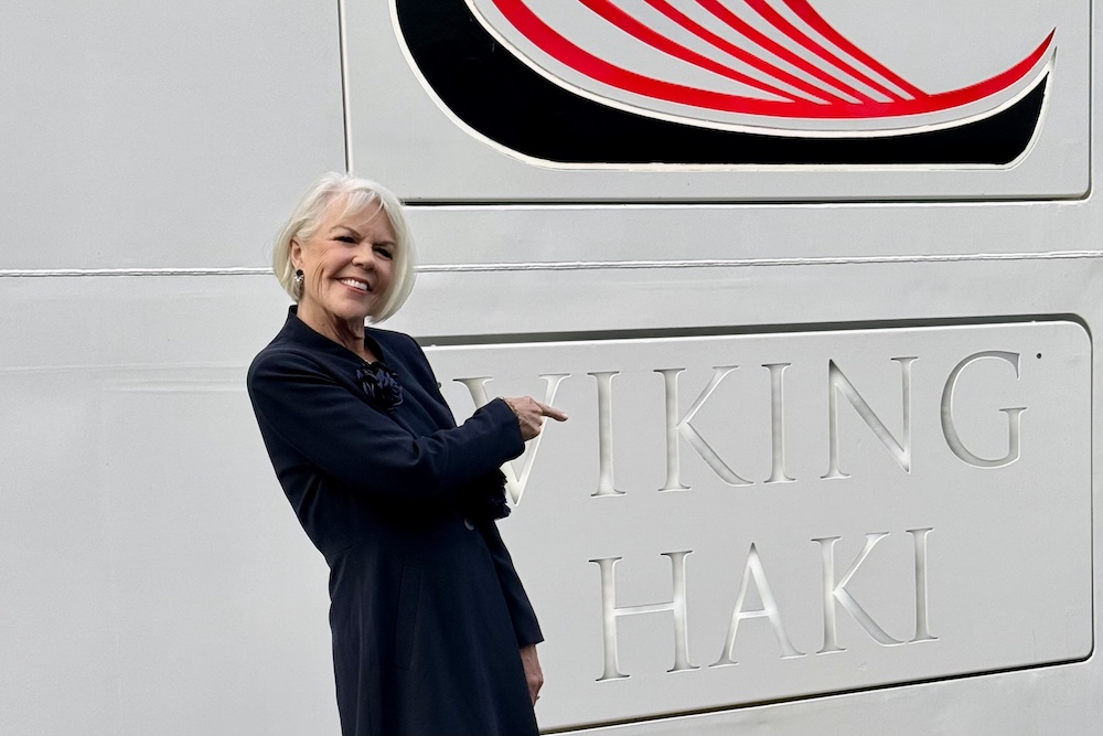 Carol Porter points to the Viking Haki name on the ship during the Amsterdam naming celebration