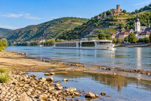 European river cruise ship navigating during low-water conditions